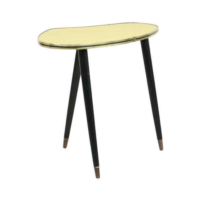 Vintage rockabilly plant table, side table with black lacquered conical legs with brass details, an organically shaped...