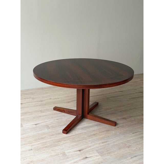 Rosewood extension dining table manufactured by Heltborg Møbler, Denmark, circa 1960s, attributed to John Mortensen. The...