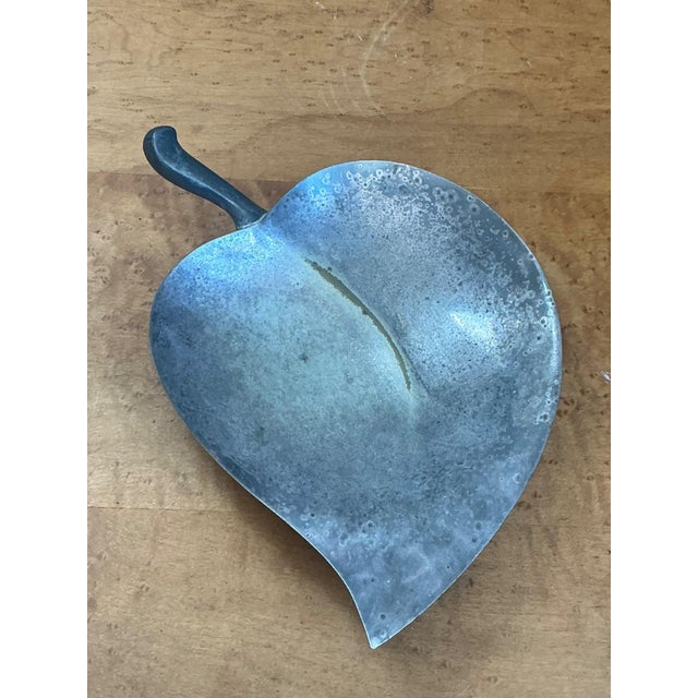 This vintage decorative metal bowl features a beautifully stylized leaf form, blending organic inspiration with refined...
