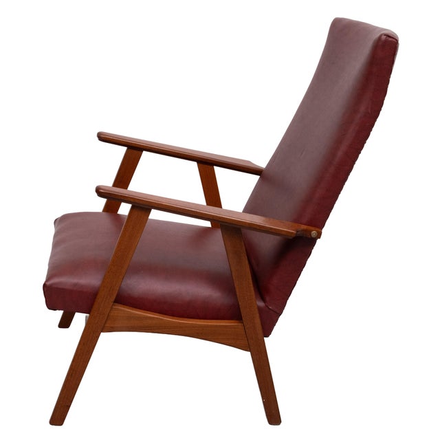 Very nice High Back Lounge Chair . Faux Leather upholstery ,Dark Red color solid Teak frame . good vintage condition ....