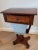 An elegant Regency period English mahogany and rosewood work table, circa 1815, in the manner of Gillows, having an...