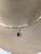 Sleek yet classic, this slide-style pendant showcases a 1.22-carat pear Ceylon sapphire, wrapped in a halo of earth-mined...