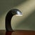Highly sculptural table lamp by Fratelli Martini, Italy, circa 1975. The design is a circular shaped black lacquered steel...