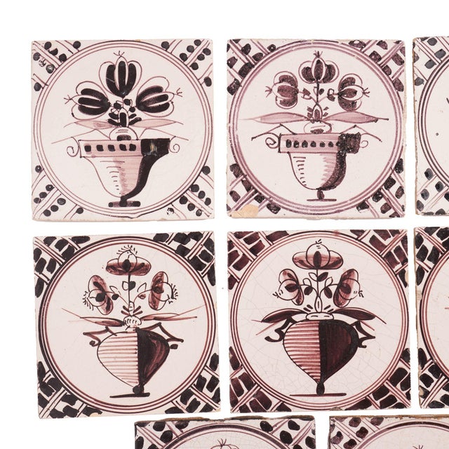 Large set of 18 mulberry decorated faience tiles. These tiles were fabricated during the late 18th to early 19th century...