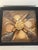 Beautiful shell art wall decor arrangement in shadow box.