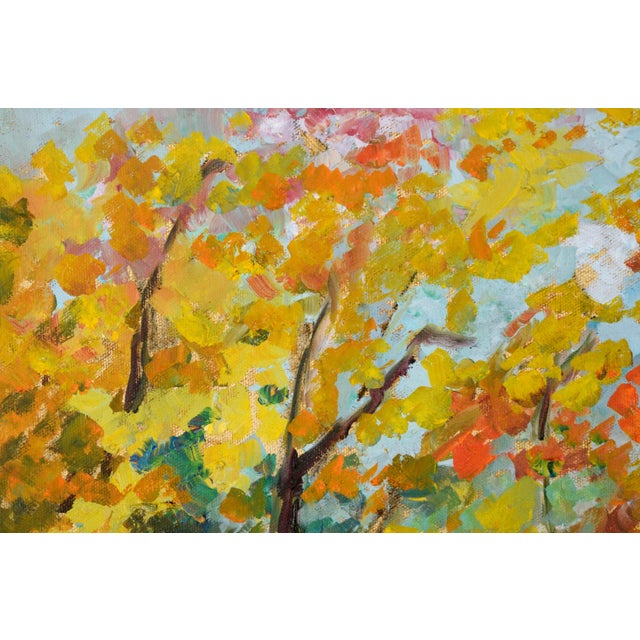 Brightly colored autumn landscape by an unknown artist (20th Century). A tranquil stream runs down the center of the...