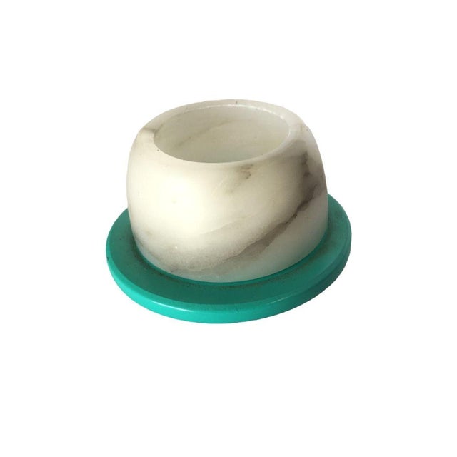 These two candlestick holder feature smooth, white alabaster holders paired with vibrant, colorful bases in turquoise and...