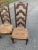 Set of three high ladder back chairs by Drexel Enterprises of North Carolina with rush seats. Only one chair has a partial...
