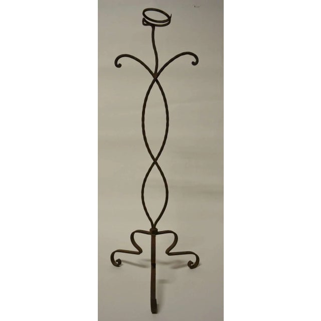 Unusual and possibly unique hand wrought free standing plant stand. Nice original old rust patina surface.
