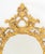 Rococo Revival Gilt Composition Framed Oval Mirror, with ornate foliate and floral design. Mirror plate: 30" H x 25" W;...
