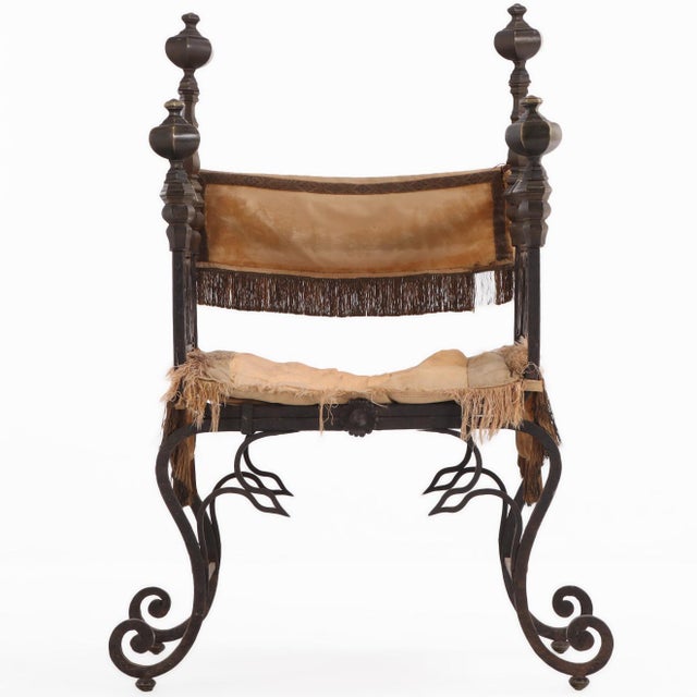A striking French Renaissance Revival “Savonarola” or court style chair, this vintage piece commands attention with its...