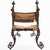 A striking French Renaissance Revival “Savonarola” or court style chair, this vintage piece commands attention with its...