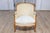 This 20th-century French bergère is an elegant representation of the Louis XV style, known for its graceful curves and...