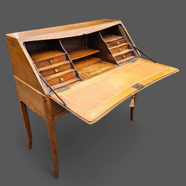 This 18th-century Louis XV Yellow Birch Bureau de Pente is an elegant piece, exquisitely crafted from solid wood and...