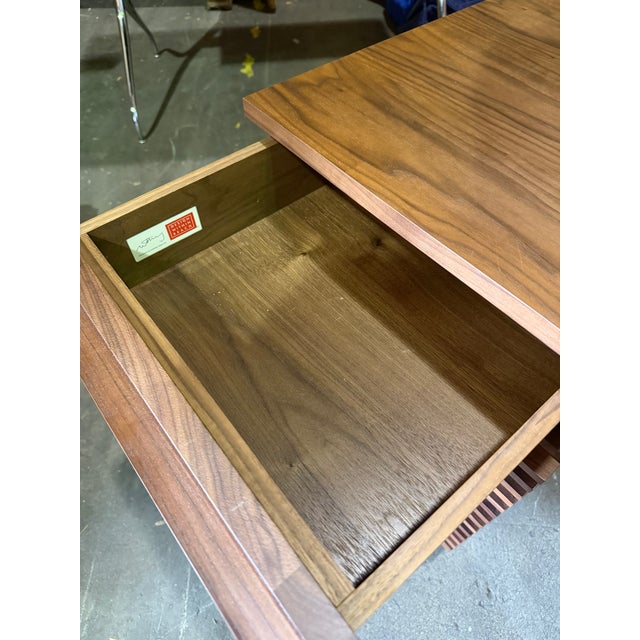 From DWR's "Line" product collection, this file cabinet features solid American walnut frame, modern seamless slat facade,...