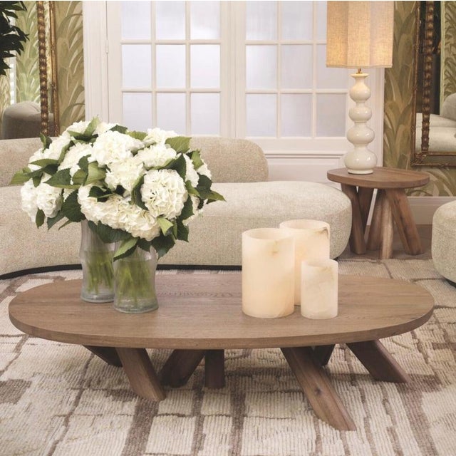 Contemporary side table crafted from oak wood, featuring an organic and elegant design. Its irregularly shaped tabletop...