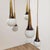 Five-light pendant lamp produced by Stilnovo, featuring a black-painted brass structure with five arms, from which cables...
