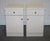 Antiques of London This pair of white bedside cabinets blends sleek design with practical storage — ideal for modern or...