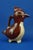 Small zoomorphic jug or milk jug in glazed ceramic, entirely hand-decorated with an airbrush, in the shape of a penguin...