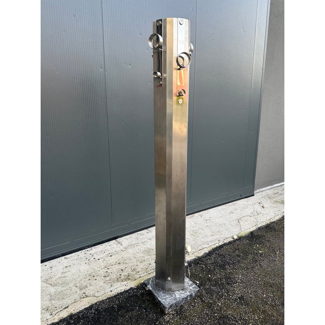 Coat hanger lamp design A. Rosselli for Saporiti 1970/79. Two steel halves, joined by two acrylic glass strips, rest on a...