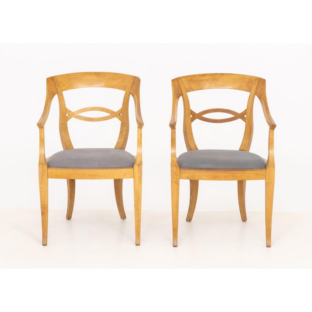 Pair of Biedermeier Style Fruitwood Arm Chairs, each with upholstered seat. 33.25" H x 21.25" W x 18.25" D; seat: 17" H....
