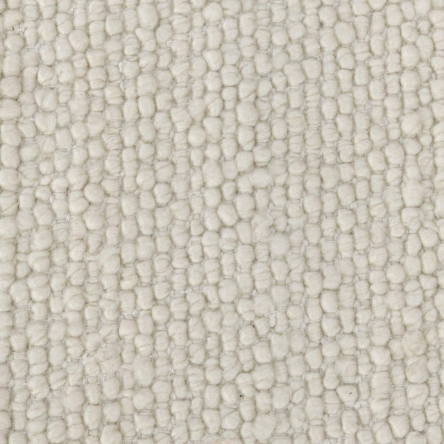 Ivory durable PET yarn rug suitable for indoor or outdoor areas. Easily styled in a wide variety of spaces with an easy,...
