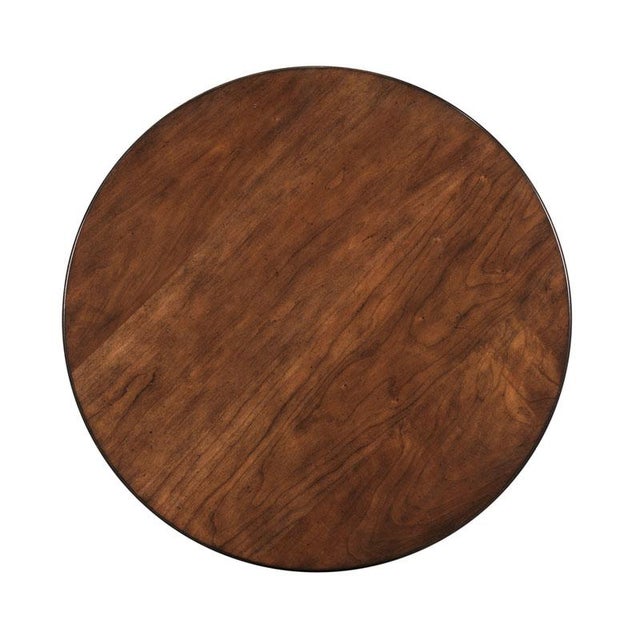 A graceful table adapted from 18th century French originals with a rectangular top resting above concave apron rails...