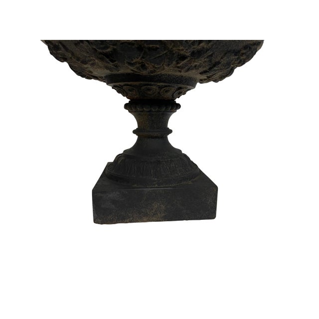 Victorian black cast iron round urn form jardinière/ planter. Pedestal base with leaf form decoration and flower petal...