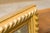 A French giltwood rectangular mirror with gadrooning from the early 20th century. This French mirror features a...
