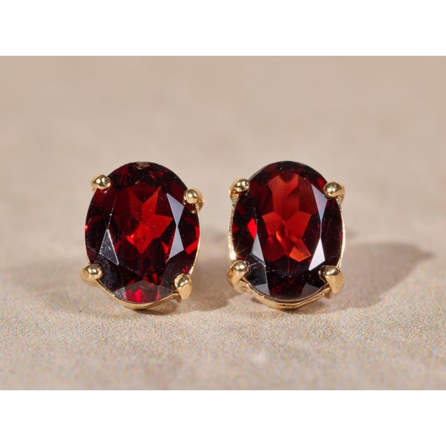 Ladies 14K Yellow Gold 4 CTW Garnet Stud Earrings. Crafted in 14 karat yellow gold, these earrings feature four total...
