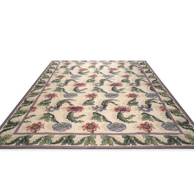 Vintage Aubusson with an all-over garden design. Large red and blue blossoms on curling green acanthus leaves repeat...