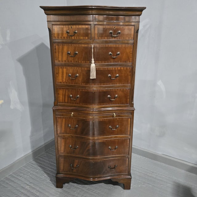 Very good two piece serpentine mahogany chest on chest of drawers, with brass swan necked handles,standing on bracket...