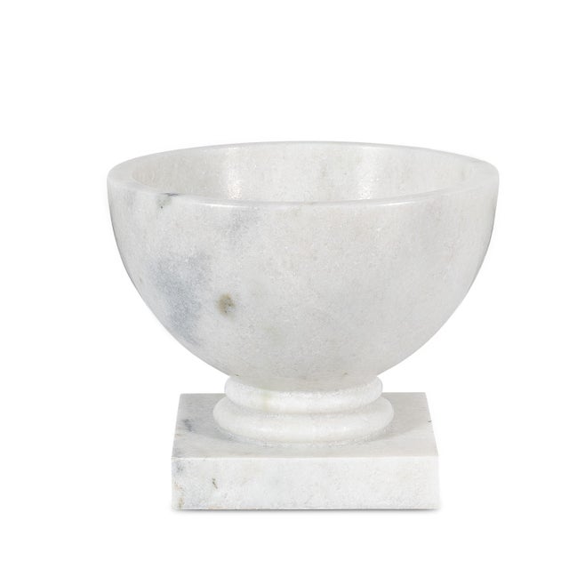 Pure in form and classical in spirit, the vase is a study in proportion and restraint. Its gently tapered vessel rests...