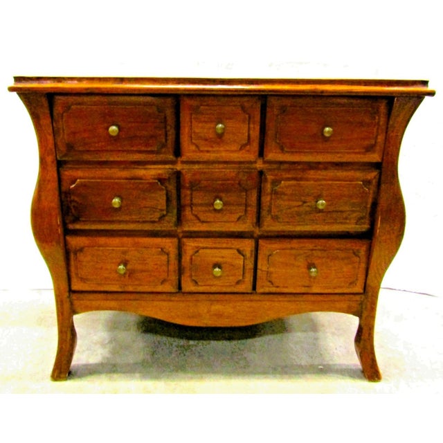 The Antique Dutch Colonial Teak 9-Drawer Bombay Chest is a stunning piece of furniture from the Edwardian era, crafted...