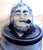 We offer this unusual Delft Porcelain Tobacco Box. It has a Barrel form with a figural lid. Wikipedia describes Delftware...