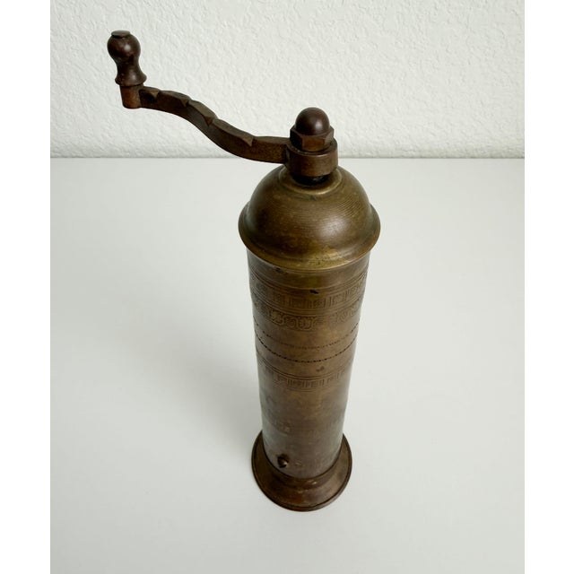 Antique brass mill or grinder for coffee, spices, salt and pepper adorned with etched botanical and grapevine patterns....
