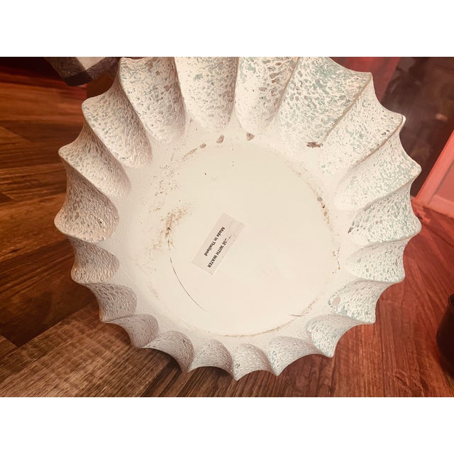 I picked this treasure up on a trip to Florida with my family. It was made in Thailand (sticker on the bottom) and sold by...