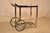 A well-built Mid Century Modern two tier, smoked glass, chrome bar cart, with exceptional high quality thick chrome work...