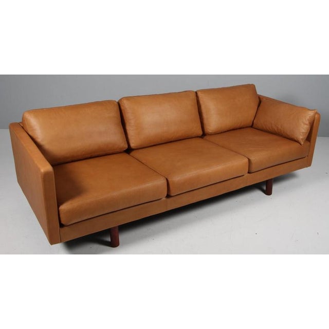 Erik Jørgensen three-seat new upholstered with cognac vintage full grain aniline leather. Legs of Mahogany. Model 220,...