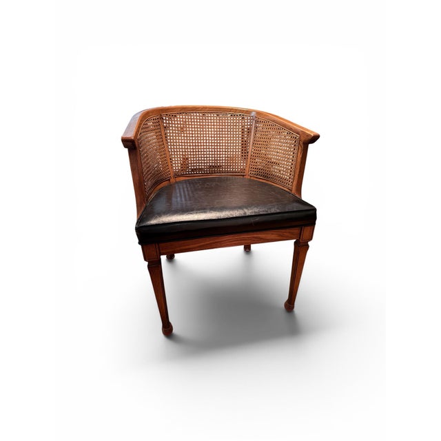 Three vintage cane backed club chairs with black leather seats and round table with fluted pedestal Chairs 22.5”w x 18”d x...