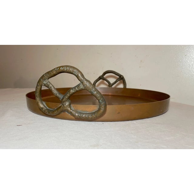 Crafted with an eye for both functionality and aesthetics, this vintage thick copper and brass centerpiece serving platter...