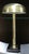 The desk lamp by Robert Sonneman and George Kovacs is an elegant brass desk lamp with a modern geometric design. It...