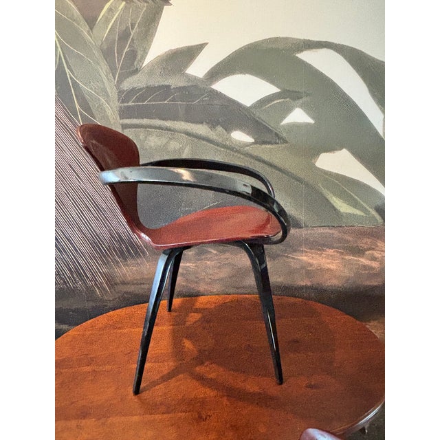 Striking pair of Cherner-style Pretzel armchairs featuring sculptural bentwood arms, molded plywood seats and backs, and...