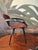 Striking pair of Cherner-style Pretzel armchairs featuring sculptural bentwood arms, molded plywood seats and backs, and...