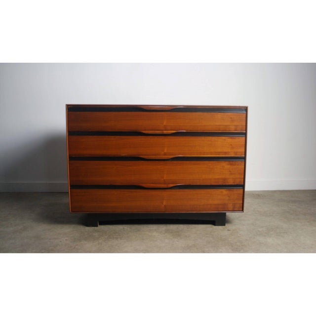 Dresser by John Kapel for Glenn of California, circa 1960 with ebony accents and curved drawer pulls. This brilliant...