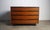 Dresser by John Kapel for Glenn of California, circa 1960 with ebony accents and curved drawer pulls. This brilliant...