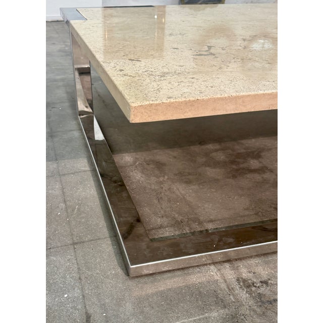 Striking Italian coffee table by Romeo Rega featuring a square marble top set within a geometric polished chrome frame....