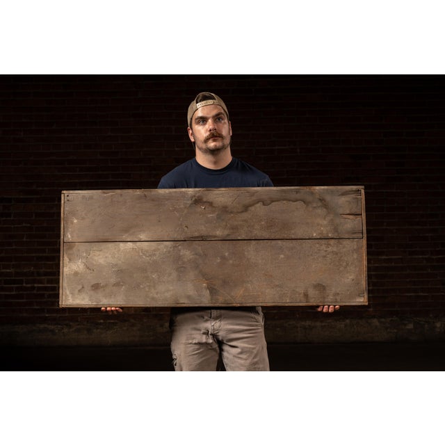 Double-plank wooden trade sign with hand-painted block lettering reading "CIGARS / CIGARETTES" in bold cream and red-...