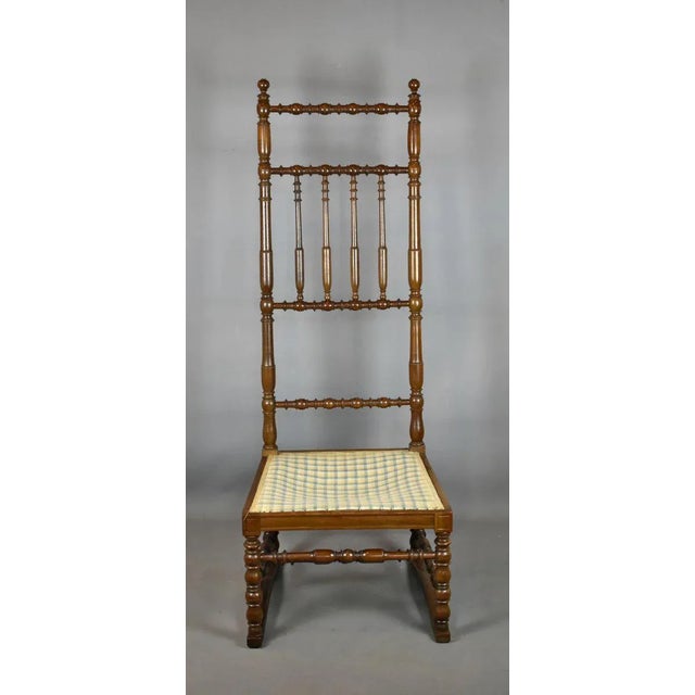 The construction of this characterful and unusual French nursing chair is mainly lathe-turned. This chair features a very...