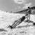 Sunbathing Skier circa 1956: With the temperature at around 80?, a skier reclines on her propped up skis and sunbathes in...
